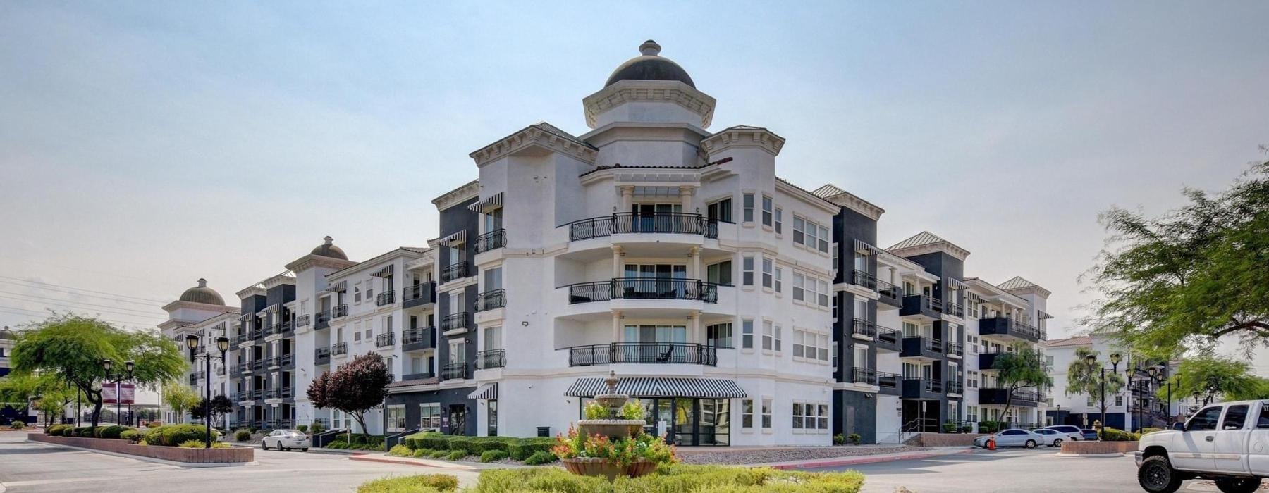 a large building with a round about in front of it